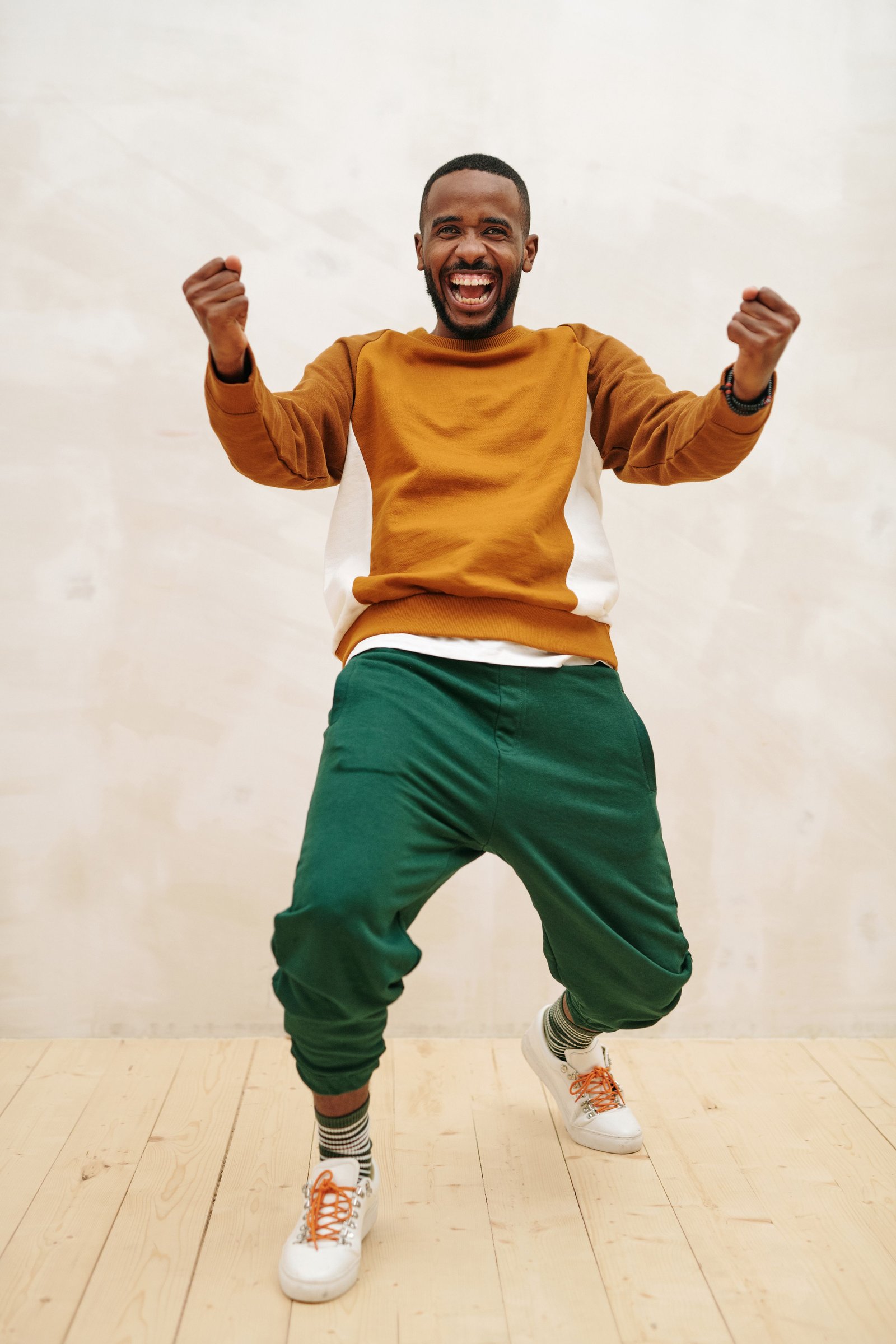 Man cheering with joy - find your happiness at work with The CHEER! Survey